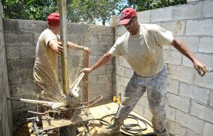 men working on well pump replacement in los molinos california