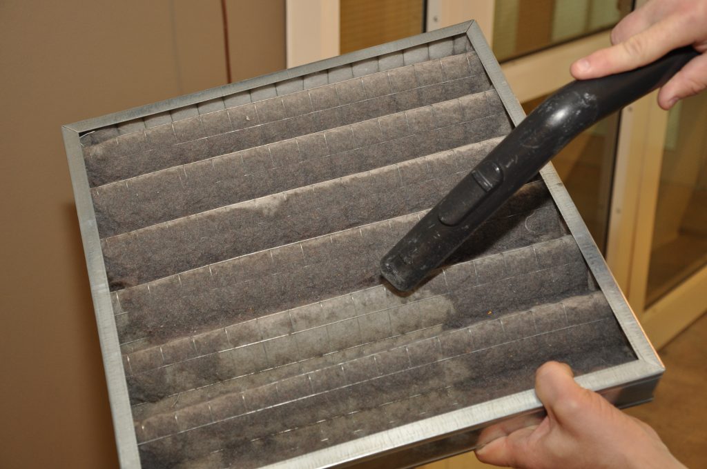 clean and vacuum your air conditioning air filter